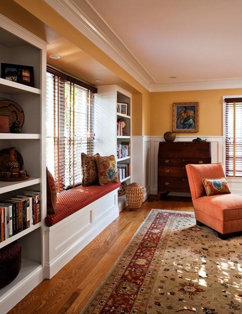 Traditional Living Room with window framed with bookshelves and window seat