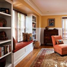 Traditional Living Room with window framed with bookshelves and window seat