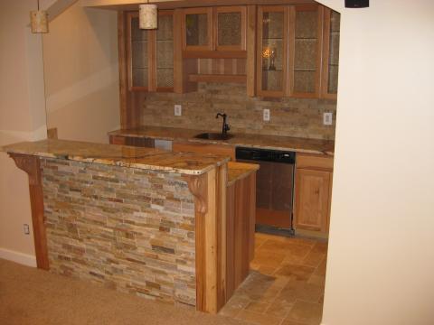 Transitional Basement with glass front cabinet doors