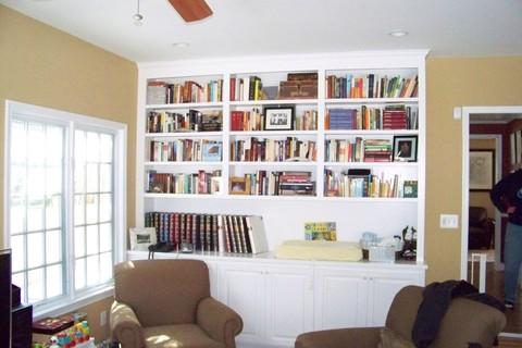 Transitional Library with brown upholstered chairs