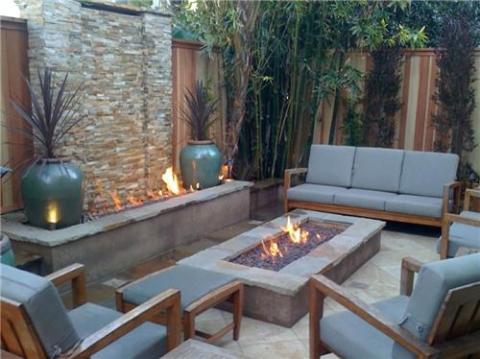 Transitional Patio with built-in fire pit with water fall feature