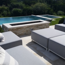 Contemporary Pool with patio seating area