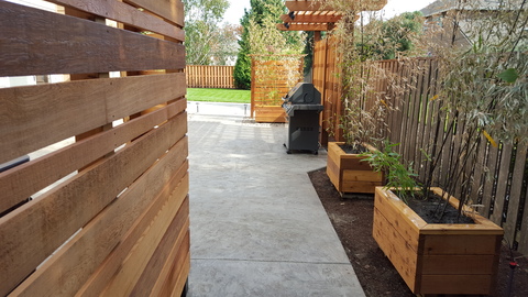 Modern Patio with cedar planter boxes