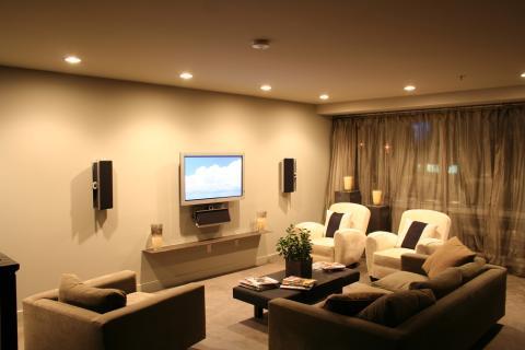 Contemporary Family Room with wall mounted speaker system