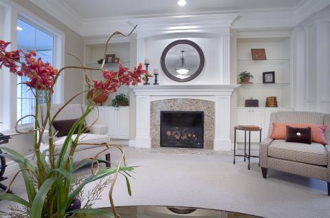 Traditional Living Room with granite tile fireplace surround