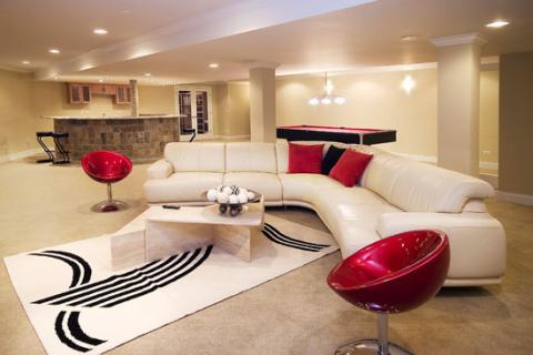 Modern Basement with hanging ceiling light over pool table