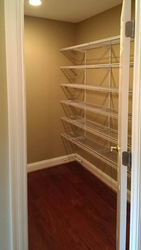 Traditional Closet with brown cherry hardwood flooring