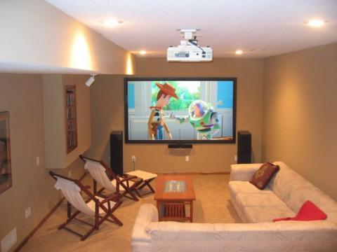 Transitional Home Theater with ceiling mounted projector screen