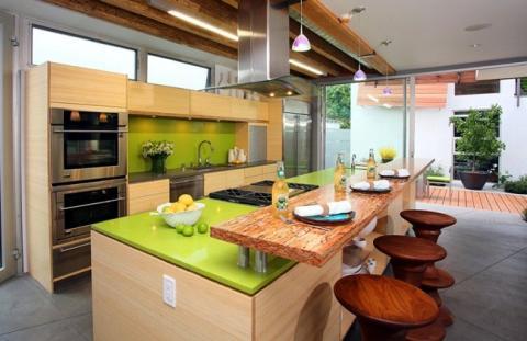 Modern Kitchen with stainless steel stove hood above island