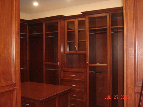 English Closet with recessed panel cabinets