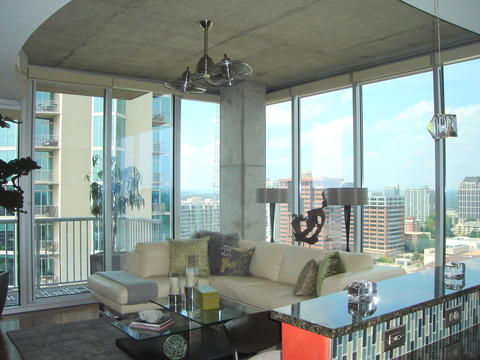 Contemporary Family Room with contemporary style family room with large windows and views of the city