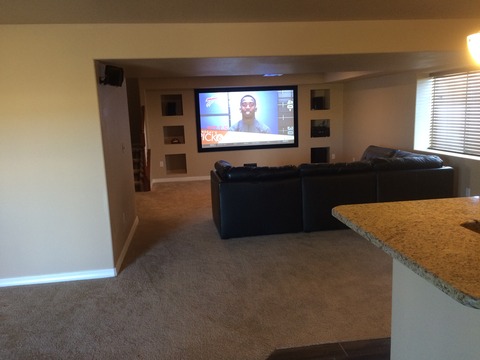 Traditional Home Theater with black leather sectional