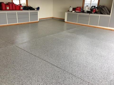 Transitional Garage with speckled garage floor tile