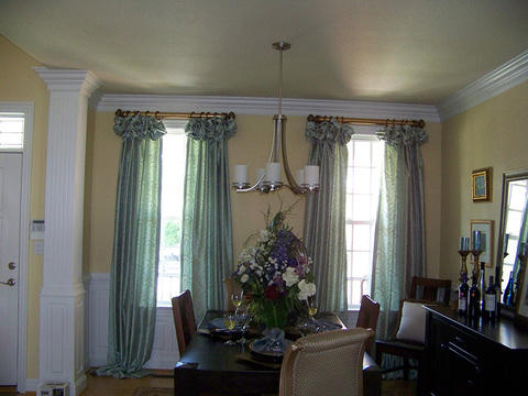 Traditional Dining Room with horizonal window over front door
