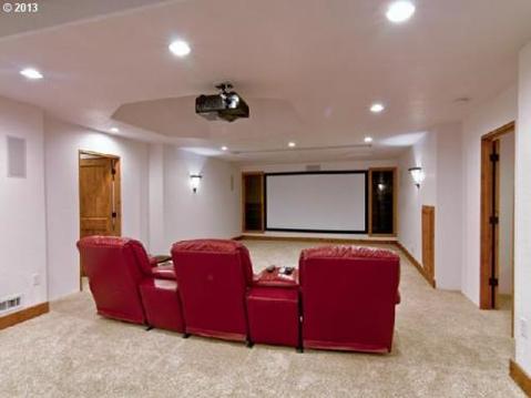 Traditional Home Theater with red leather theater chairs