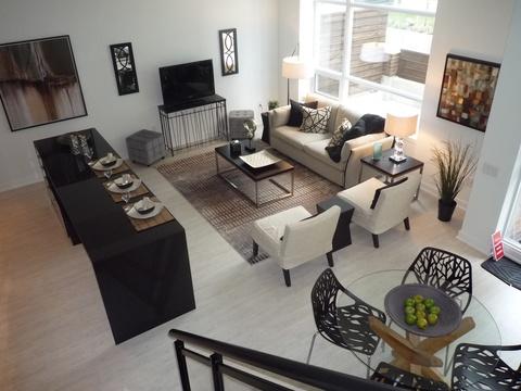 Contemporary Family Room with black top coffee table and side tables
