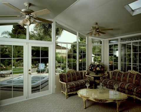 Contemporary Sunroom with upholstered loveseat