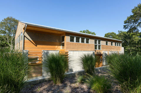 Modern Home Exterior with wood panel siding