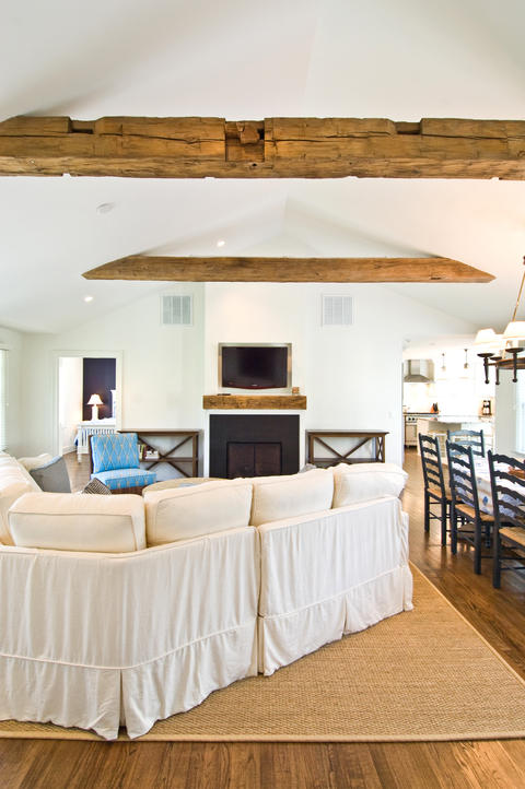 Modern Family Room with rustic reclaimed wood mantle