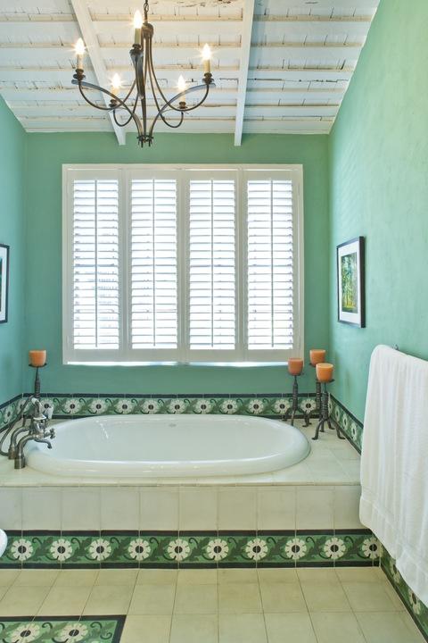 Eclectic Bathroom with white plantation shutters