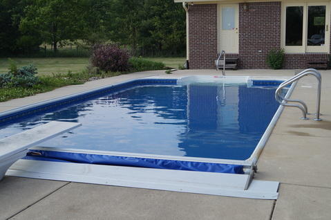 Transitional Pool with brushed nickel safety rails
