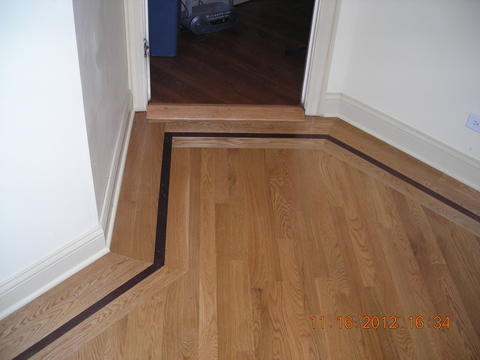 Transitional Entry with strip hardwood flooring