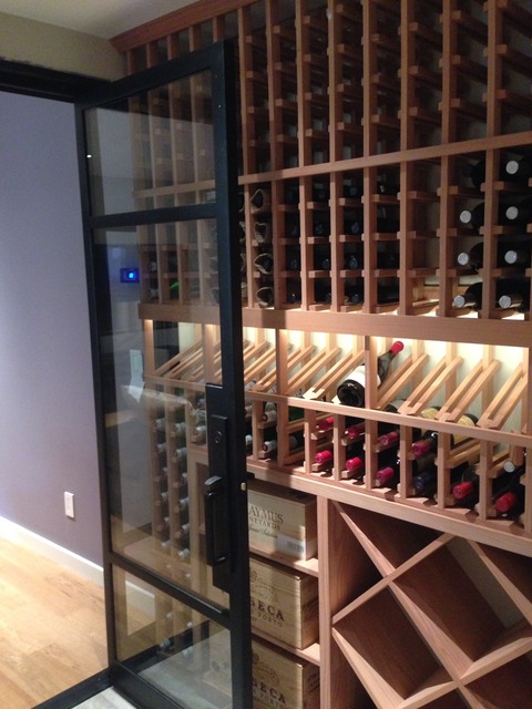 Contemporary Wine Cellar with glass sidelight panel