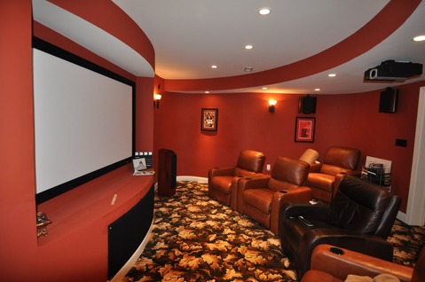 Traditional Home Theater with leather reclining chair
