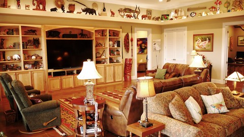 Eclectic Family Room with recessed built in media cabinet and bookcase