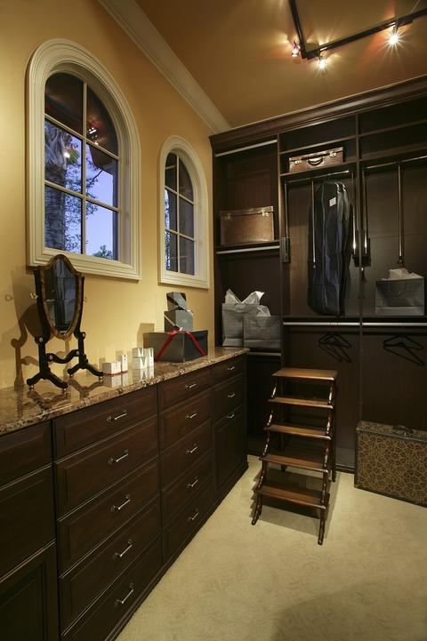 Traditional Closet with beige granite countertops