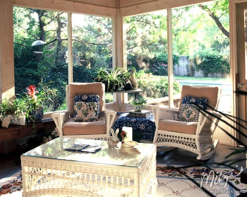 Traditional Sunroom with beige upholstered cushions