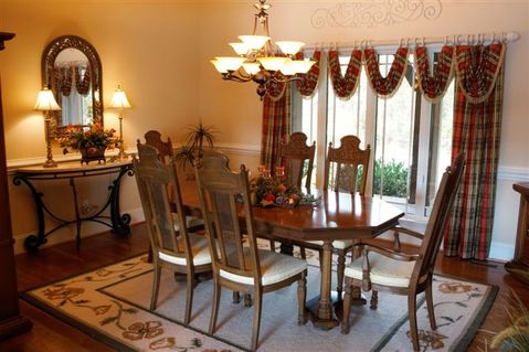 Eclectic Dining Room with wide white floor molding