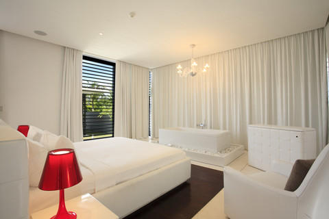 Modern Bedroom with baxton simpla red acrylic lamp