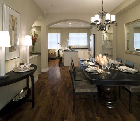 Transitional Dining Room with black large pedestal table