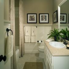 Traditional Bathroom with beige and white striped shower curtains