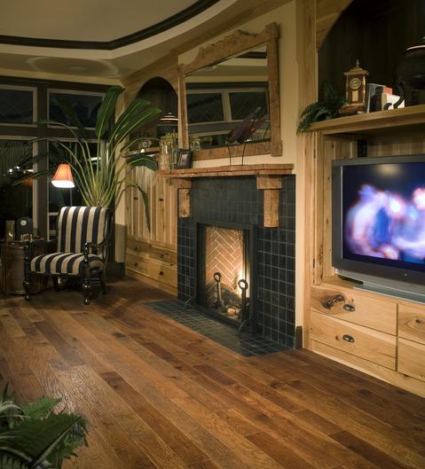 Eclectic Family Room with light rustic wood framed mirror above fire place