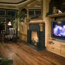 Eclectic Family Room with light rustic wood framed mirror above fire place