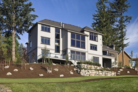 Contemporary Home Exterior with stone retaining wall