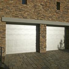 Transitional Garage with dark gray stone brick driveway