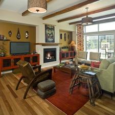 Eclectic Family Room with stained wood ceiling beams