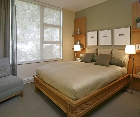 Contemporary Bedroom with medium wood stained bed