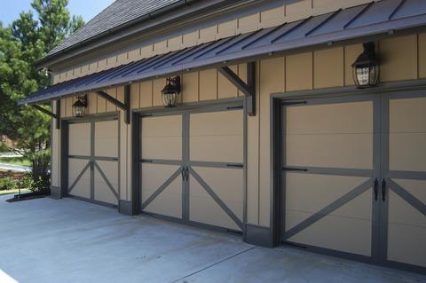 Transitional Garage with wrought iron hardware