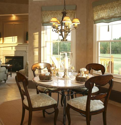 Transitional Dining Room with wrought iron table base