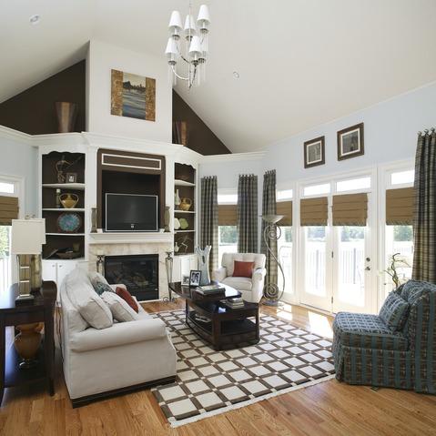 Traditional Family Room with geometric pattern rug
