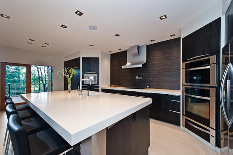 Modern Kitchen with white solid surface countertop