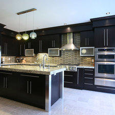 Modern Kitchen with varied color hanging pendants