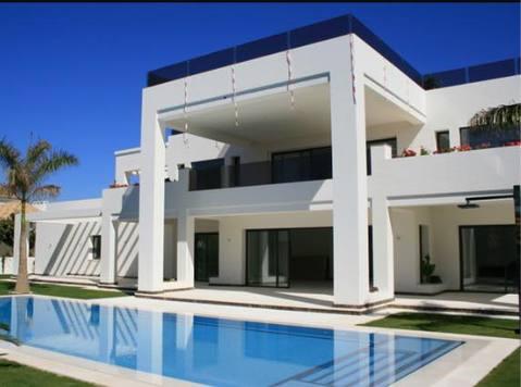 Modern Home Exterior with black transparent railing