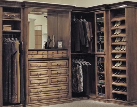 Traditional Closet with medium stained raised panel drawer fronts