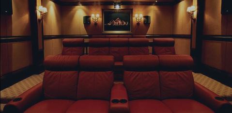 Traditional Home Theater with wide mahogany stained floor molding
