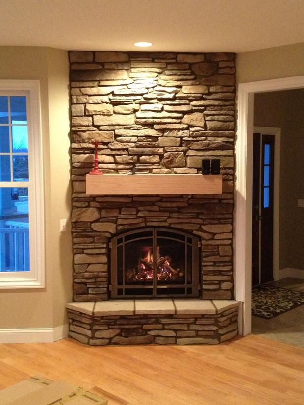 Traditional Fireplace in Shelby Township - beige painted walls, rock ...